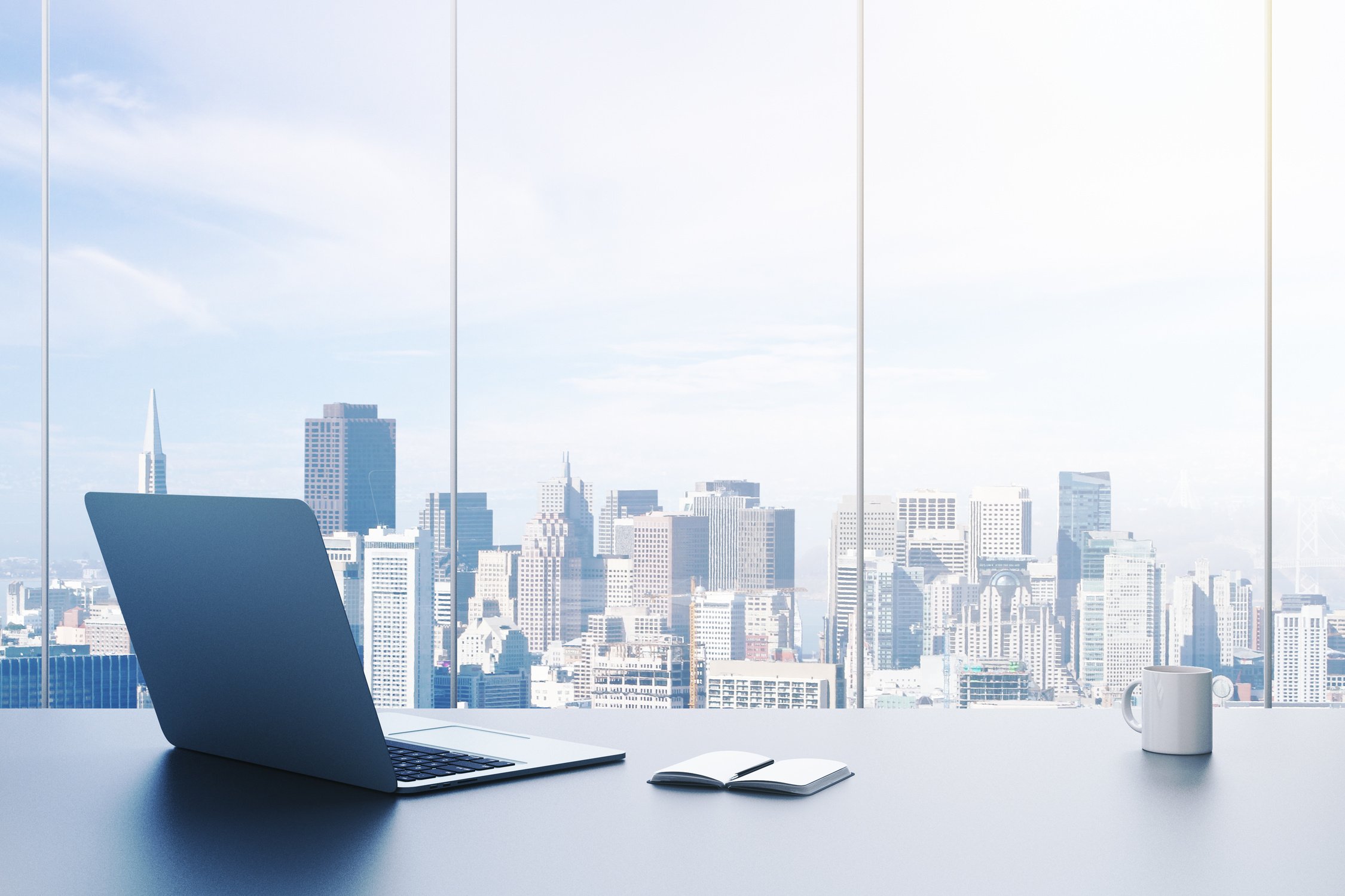 Office desk with city landscape as a background